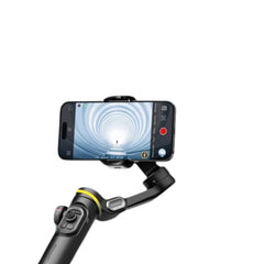 OBtech AOCHUAN Smart XE 3-axis gimbal stabilizer holding a smartphone displaying a cinematic tunnel view.