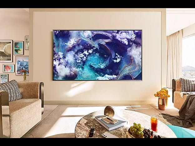 OBtech Samsung 75-inch Neo QLED 8K smart TV mounted on a wall in a modern, brightly lit living room.