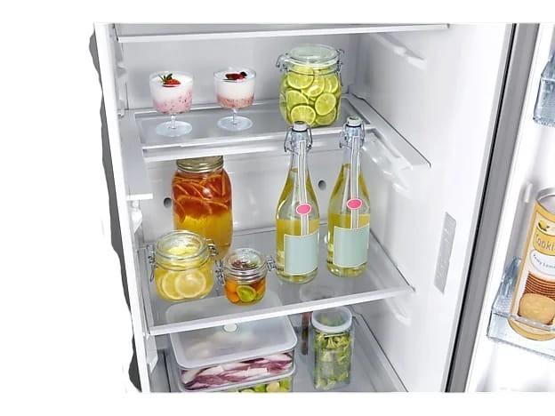 Interior view of OBtech Samsung 375L refrigerator with adjustable shelves stocked with food and glass bottles